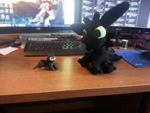 Crocheted Toothless and Tiny Sculpey Toothless