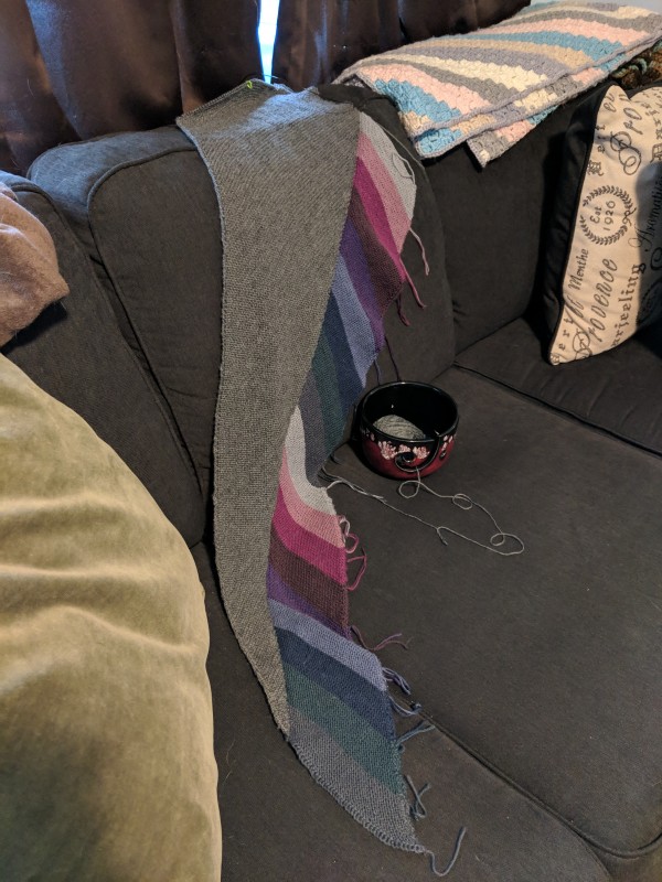 Photo of a shawl draped over a couch.