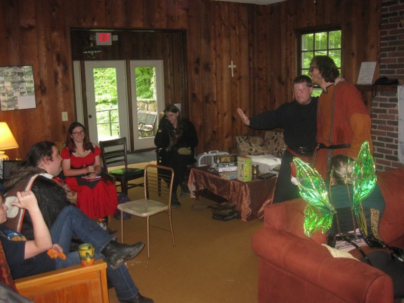 Scene from a game of Kishar. My character, Elinyr, is seen holding her red notebook.
