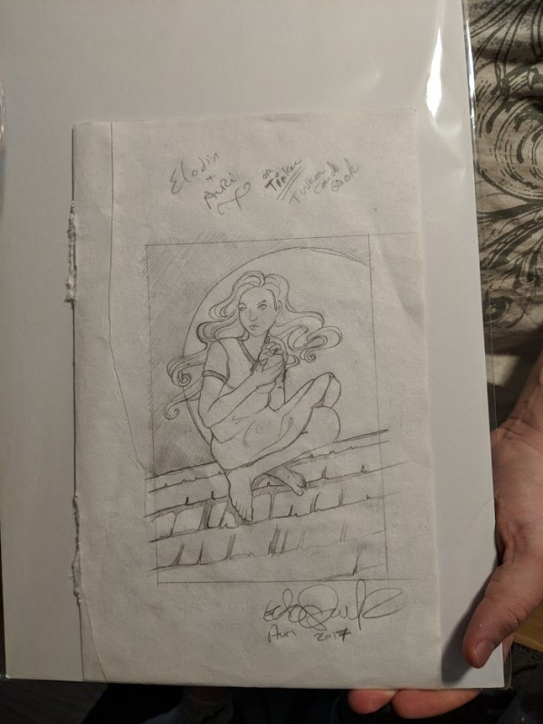 The same Auri sketch from earlier, being held by my friend J.