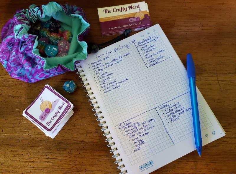 Keeping organized, the convention-goers edition: Notebook open to a packing list for Gen Con,.